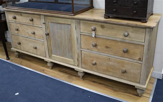 A pine kitchen sideboard W.231cm